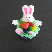 Jelly Bean Bunny Cupcakes Fondant bunny head and feet. Icing is buttercream. Middle of cupcake filled with jelly beans.