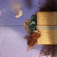 Christmas Box Cake Fondant covered cake with gold luster dust painted on surface.