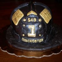 Fire Fighter Helmet This cake was made just for the birthday boy. It was a replica of his father's helmet.