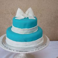 Jon's Wedding Cake fondant with buttercream piping.