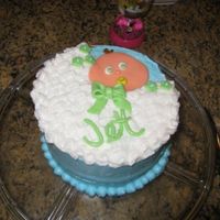 Allie's Baby Shower All buttercream with fondant accents for baby, bow, flowers and lettering.