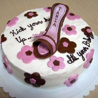 Tania's Birthday Shoe Cake - High Heel Buttercream with fondant and MMF accents. The cake was vanilla with strawberries and cream filling. The shoe was made out of fondant and I...