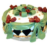 Welcome Home - Romantic Cake Chocolate cake with strawberry filling. Covered in MMF with MMF swags and bow and diamonds. The gold is luster dust painted over royal...