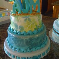 Surfs Up Baby Shower! Airbrushed hawaiian flowers on buttercream. Cake topped with three airbrushed surfboards made of sugar paste, and three letters are made...
