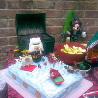 Mickey Mouse Pirate Pineapple Cake For Daniel :) This is another picture of the pirate pineapple cake made for my son. Has pineapple chunks and whipcream between layers of pineapple cake...