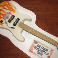Flaming Guitar Did this up quick for my son's belated birthday party. His cake request was a "guitar with flames". Not my best work but...