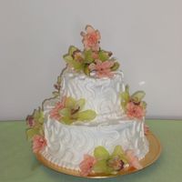 Bridal Shower First stacked ckae. Special thanks to kimhamjohn for all her help. 10 inch choc. 6 inch white. All buttercream with silk flowers that the...