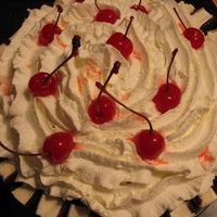 Ice Cream Cake My famous icecream cake! I get asked to make this a lot! Icecream sandwhiches for border, strawberry icecream, sundae toppings on top of...