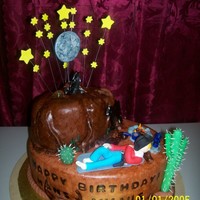 Cowboy Under The Stars everything is completely edible. made the cake look like leather by texturing the fondant. and the name on the side looks like it had been...