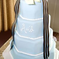 Octagon Wedding Cake Octagon shaped, all fondant covered. Top and 3rd tier carrot cake with cream cheese filling. Other tiers almond pound cake with raspberry...