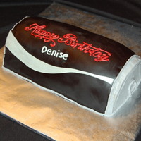 Coke Zero Can 5 1/2 cakes cut from 6 inch rounds, iced in buttercream, black fondant. Lettering done in buttercream.