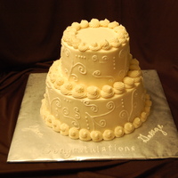 50Th Anniversary 2-9inch double rounds, topped by 2- 6 inch double rounds, fed 40. All buttercream.
