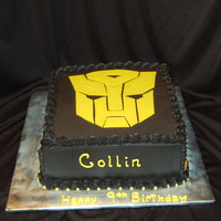 Transformers 10 inch double square, fed 40. Transformer done out of fondant.