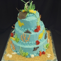 Coral Reef 2- 12 inch doubles, 2-9 inch doubles, topped by 2-6 inch doubles, fed 100. Royal icing orange coral, fondant accents.