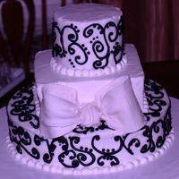 Pa111424.jpg red velvet cake with cream cheese filling. Iced in buttercream. This was my first time using gumpaste and doing scrolls . I definitely see...