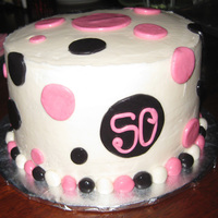 Mod Momma Marble WASC with vanilla buttercream. 8"x4" Fondant circles and buttercream icing.