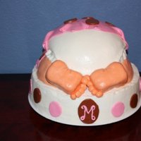 Madisen Baby Rump 10" with round pan for rump. RKT for feet. 10" with buttercream. Baby rump covered in fondant. Fondant blanket.