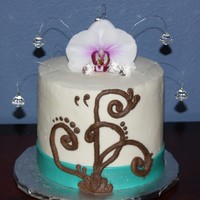 Elegance 6" x 5" yellow almond sour cream cake with a caramel baileys buttercream filling. White buttercream finish with fondant ribbon...