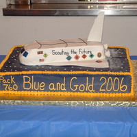 Blue And Gold Shuttle Cake Space Shuttle cake for my son's Cub Scout Pack Blue and Gold ceremony. 'Fins' made from fondant/gumpaste.