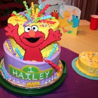 Surprise! Elmo 8"- 10" tiers, fondant Elmo, curlicues and handmade confetti. This cake was absolutely the cake from HE!!. I baked the top tier 3...