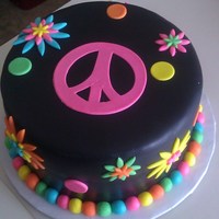 Flower Power Inspired by the party invitation that I designed as well for an 11 year old girl. Love the bright colors on the black fondant.