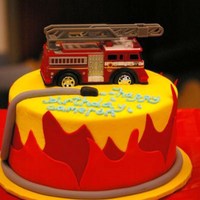 Cameron's Firetruck Cake I made this cake for a friend's little boy. He wanted flames all around the cake. I got a toy firetruck to use on top.