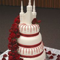 Stacked Wedding Cake With Red Roses This is a chocolate and MM fondant cake I made last spring with fresh red roses. The 'drop' lines are made using red licorice and...