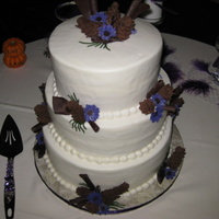 Pinecones Wedding Cake This I think is now one of my favorites. My friend brought in the picture of what she wanted. It had to have pine cones and chocolate curls...