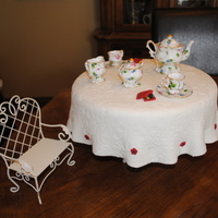 High Tea tea set is not edible, but the table is! white cake, custard filling covered in mmf. thanks for looking