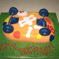 Skateboard This is my representation of a skateboard design I saw on line. After all was said and done it did not look like a cake for a 13 year old...