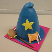 Wizards Hat The little girl was very specific to what she wanted. Stacked 5 8 inch cakes and carved to look sort of like a hat. covered in BC and...