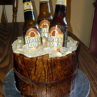 Beer Barrel Completely edible except for the beer labels. Bottles and ice are sugar, bottle caps and wood planks around the cake are fondant. Thanks...