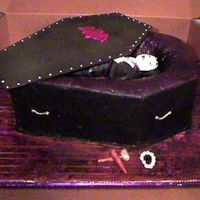 Dracula mmf dracula in a vanilla and carmel cake. buttercrem decorated cake with mmf lid.