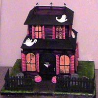 Haunted House White cake in butter cream. royal icing and mmf details.