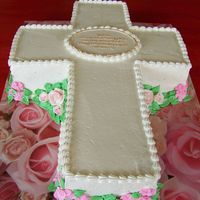 Confirmation Cake Cross cut from a 9 x 13 sheet cake. Chocolate cake iced in white buttercream with royal icing flowers. Flowers were strategically placed to...
