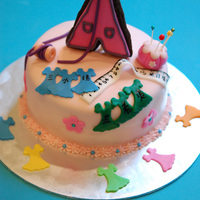 Seamstress Cake The dress is made of cookie and covered with fondant and royal icing. Made all the other sewing stuff with fondant.This is a chocolate-...