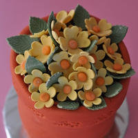 Flower Pot The flowers are made out of gum paste and the pot is made of 4 inch vanilla cake with strawberry and rhubarb jam.