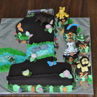 Jungle Theme For A No.1 Cake I carved the no.1 out of a 6 and 8 inch square cake. Animals are made of fondant, requested by the customer.Covered with chocolate fondant...
