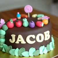 Hungry Caterpillar Was tasked to do a Hungry Caterpillar theme. So thought up of this 6 inch chocolate fudge cake covered with chocolate fondant cake, filled...
