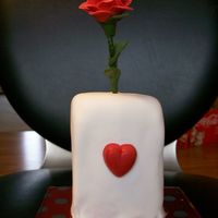 Single Rose With Vase Second try at fondant; boy, do I have a lot to learn!! This was suppose to be a vase with a single red rose. The vase was two mini loaf...