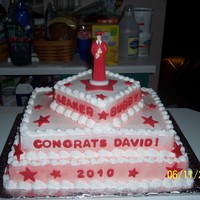 Dave's Graduation 11x15, 9x13, and a 6inch cakes stacked, iced in buttercream and decorated with fondant stars and names.