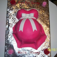 Baby Bump Cake I used the small wonder pan and the regular wondar pan and covered in fondant.