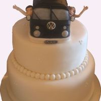 Wedding Cake And Topper Two tier, ivory iced wedding cake , with Campervan, Bride & Groom Topper.