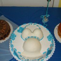 I Made This For A Friends Babyshower this is my first pregnant belly cake, milkyway on the left