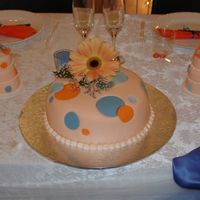 Round Dots Retro This cake was choc/orange marble and was designed from the invitation. We added the mini cakes for the bride and groom. All is done in...