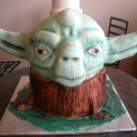 Yoda 3D carved yoda head and tree stump. All cake except yodas ears are rice krispies