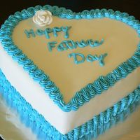 P1020934.jpg Fathers Day Cake, yellow cake covered with fondant with Vanilla buttercream Icing decorations and a fondant rose.