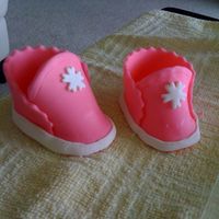 First_Baby_Shoes_2.jpg My First Baby's Shoes. All Fondant...Not very excited, but I'm sure I will do better next time...one shoe is smaller than the...
