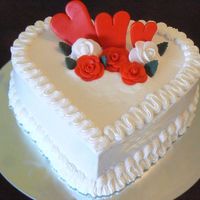 P1020910.jpg Wedding Aniversary Cake. Chocolate Cake with Almond Buttercream Icing and Fondant Decorations.