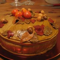 Basket Cake With Leaves, Apples And Acorns chocolate cake w chocolate ganache and fresh raspberries, covered in MMF, w MMF decorations. Thank you for looking and thanks the others...